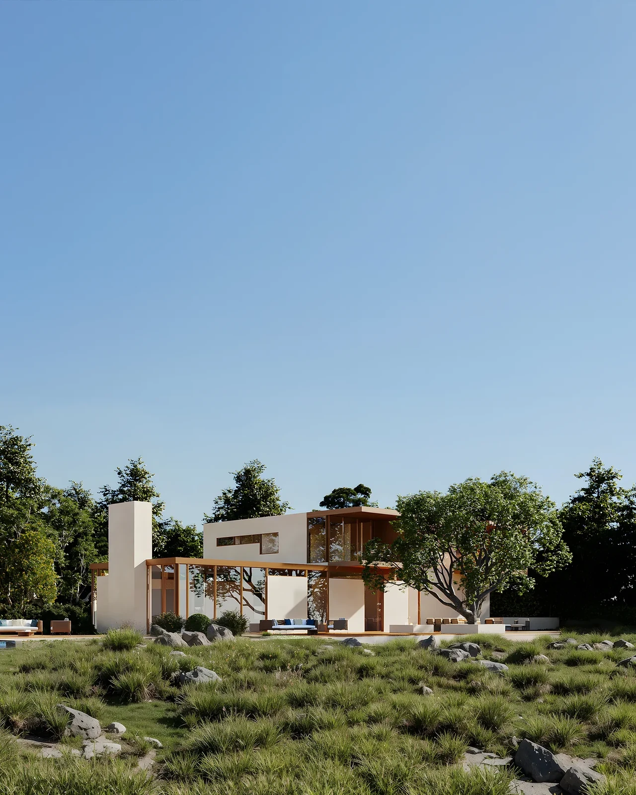 Modern desert villa set within a low natural landscape under clear daylight